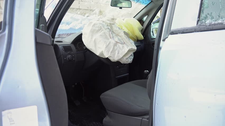 Deployed car airbags after a collision, car accident, vehicle security system after car crash. Deflated air bag, a Healthcare Video by ProleR