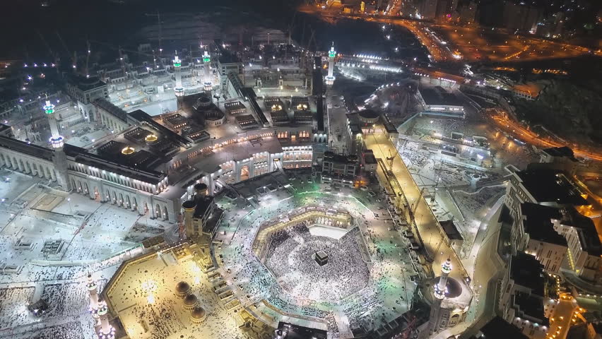 MECCA, SAUDI ARABIA - View of the central square of Mecca near the Masjid al-Haram from the balcony at the top of the clock tower or Abraj al-Bayt. Royalty-Free Stock Footage #1102701823