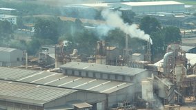 Industrial exhaust fumes appear as visible emissions or plumes of gases, smoke. These emissions can negatively impact air quality and human health if not properly controlled or mitigated. 4K Drone
