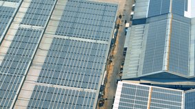 Solar panels on the industrial factory roof in the context of clean energy would convey a message of progress towards a more sustainable future, a tangible solution for reducing carbon emissions. 4K
