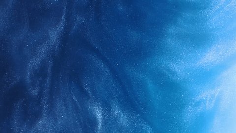 Glitter fluid abstract background. Ink water. Sea wave. Blue color shimmering glowing grain dust mist texture liquid paint splash motion. Arkivvideo