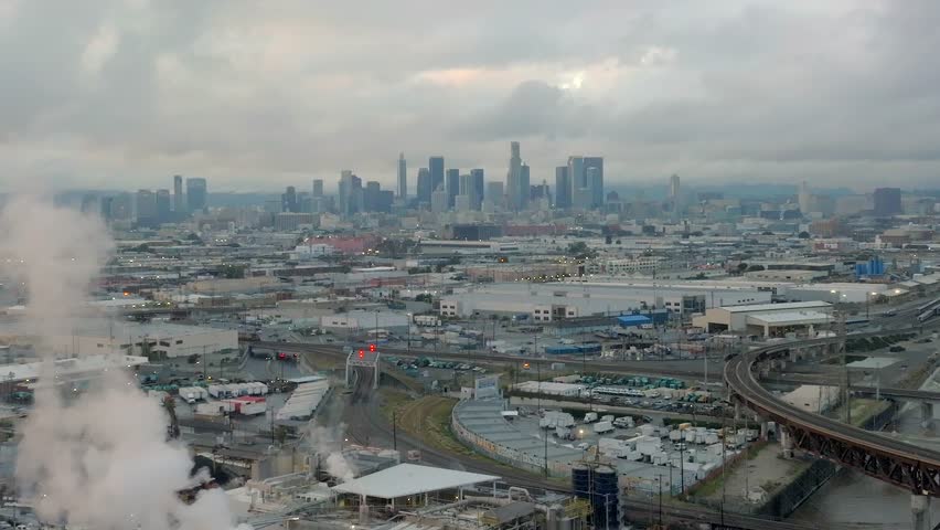 March 2023 - 4K aerial of full LA River on a stormy day in Downtown Los Angeles, California, USA.