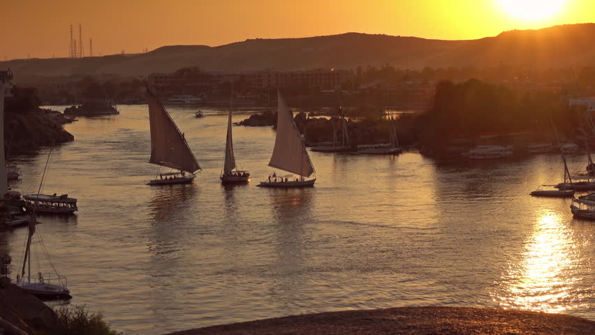 Beautiful view on felucca boats on Nile river in Aswan at sunset, Egypt Royalty-Free Stock Footage #1102716211