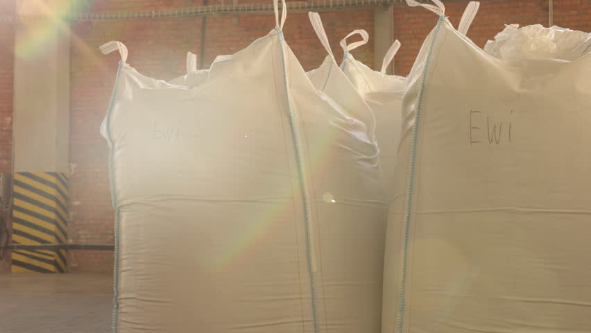 Product inventory, Bulk transportation, Sack supply. Large number of bags holding products or raw materials are present in industrial facility. Royalty-Free Stock Footage #1102717795