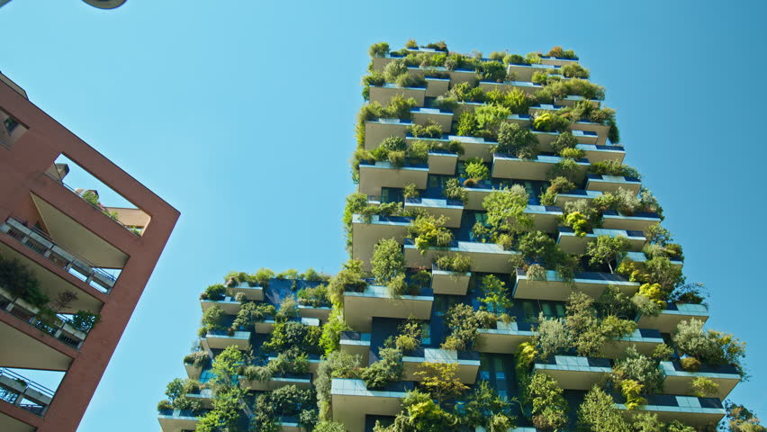 The Bosco Verticale with trees, shrubs, perennials, and ground cover line the facade of two residential towers. Modern buildings in the Porta Nuova district of Milan, region of Lombardy, Italy.