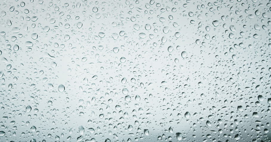 Rainy day water drops fall down on window transparent glass abstract background. Natural bad weather gray colors. Royalty-Free Stock Footage #1102722627