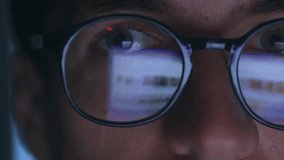 Close up male working at computer late at night, reflection in glasses of laptop screen. Double exposure monitor screen reflection, business male using laptop computer internet, surfing web pages - Powered by Shutterstock - Get 15% off with code: PIKWIZARD15