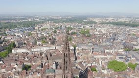 Inscription on video. Strasbourg, France. The historical part of the city, Strasbourg Cathedral. Multicolored text appears and disappears, Aerial View