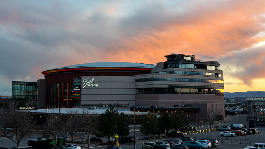 Denver , Colorado , United States - 04 08 2023: Vibrant sky sunset timelapse over iconic Ball Arena