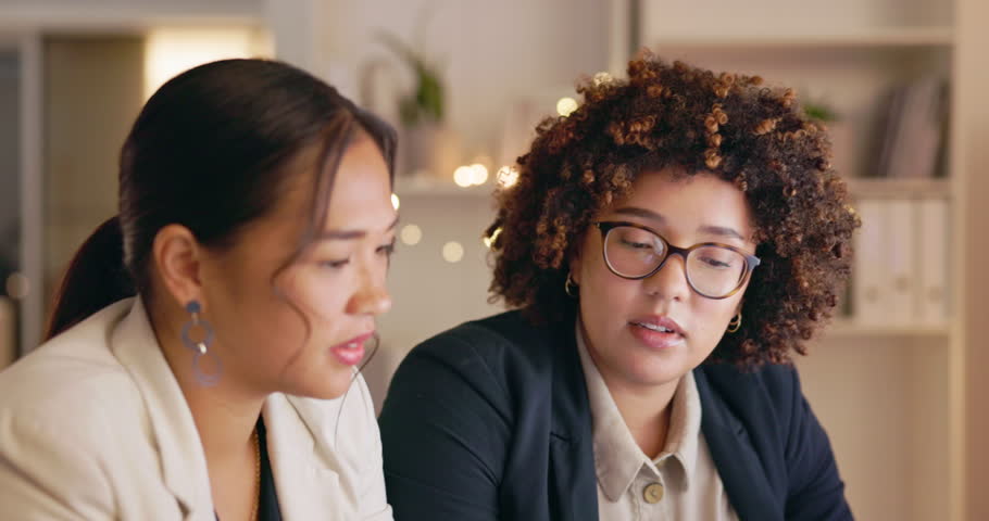 Planning, talking and business women in night office with research, collaboration ideas or company management. Professional biracial people, manager or person with happy advice, thinking and speaking