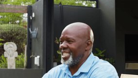 Grandfather having fun playing with laughing granddaughter in garden at home lifting her in the air - shot in slow motion - Powered by Shutterstock - Get 15% off with code: PIKWIZARD15