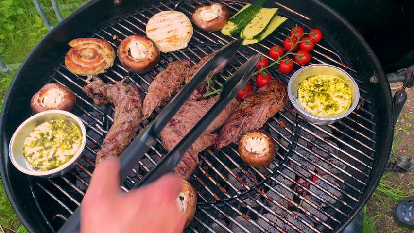 Vegetables and meat on the barbecue. Selective focus. Food. Royalty-Free Stock Footage #1102745433