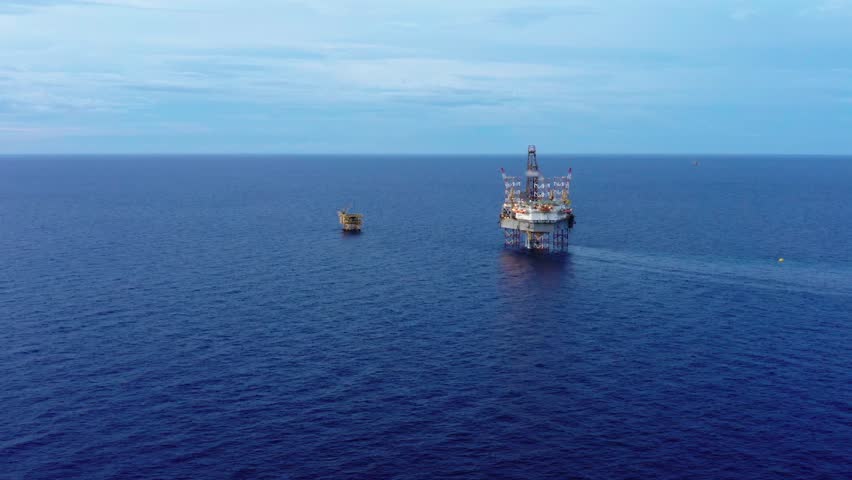 Aerial view from a drone of an offshore jack up rig at the offshore location during day time
