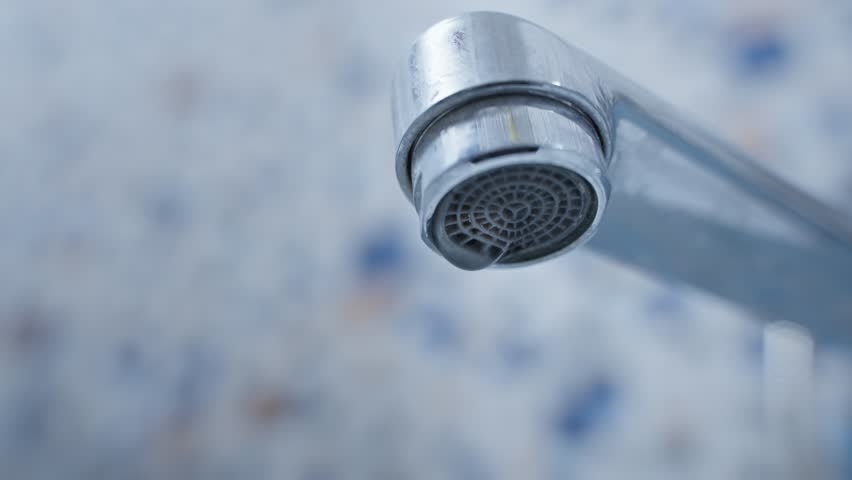 leaking faucet. dripping tap close up. drops of water dripping from spout of water faucet. leaking plumbing. leaky faucet valve. waste of water concept. save water by fixing leaky pipes. slow motion Royalty-Free Stock Footage #1102758345