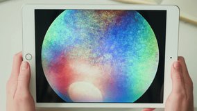 Doctor veterinarian examining horse eye iris close-up. Woman vet analyzing animal vessels on gadget tablet. Healthcare and medicine concept, ophthalmology.  - Powered by Shutterstock - Get 15% off with code: PIKWIZARD15