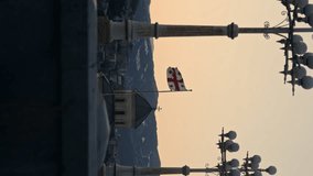 Sunset over Tbilisi Monastery with Georgian Flag. Vertical video