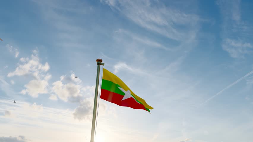 Burma national flag waving in beautiful blue sky. Flag of Burma waving in the wind, sky and sun background. Mynmar Flag Video. Realistic Animation, 4K UHD.  Royalty-Free Stock Footage #1102766475