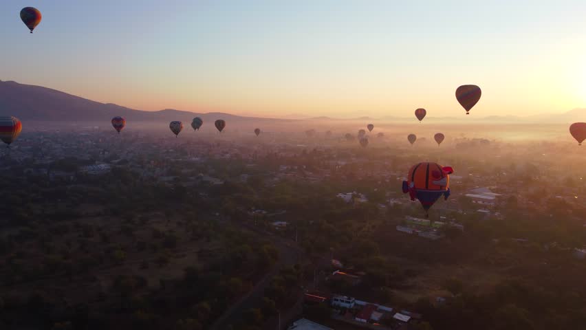 Sunrise on hot air balloon over the Teotihuacan pyramid