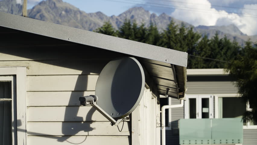Timelapse in Queenstown of the analogue antenna with a background of clouds over the mountains