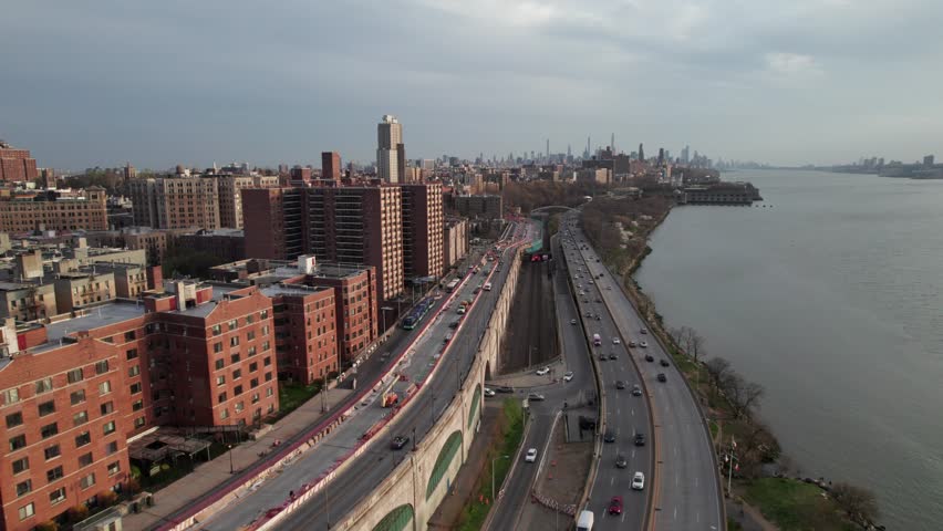West Side Highway, New York. Traffic heading toward downtown Manhattan. Smooth aerial shot.