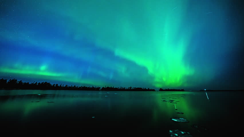 Aurora Borealis night sky reflecting from Lake Superior in USA - Time-lapse view