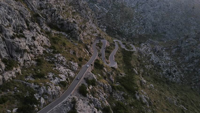 Aerial shot of cars passing through the snake road Sa Calobra in Mallorca, Spain