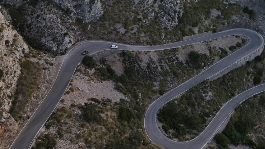 Aerial top shot of cars passing through the snake road Sa Calobra in Mallorca