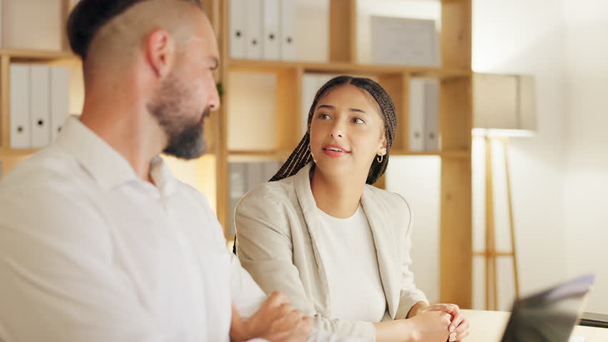 Training, man and woman in office meeting with ideas, opinion or collaboration on creative project together. Happiness, teamwork and coaching, employees brainstorming at computer at design agency.