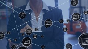 Animation of network of connections with icons over caucasian businesswoman working in warehouse. Global shipping, networks, business, computing and data processing concept digitally generated video. - Powered by Shutterstock - Get 15% off with code: PIKWIZARD15