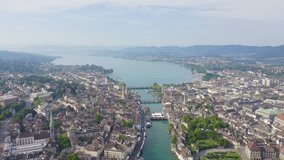 Inscription on video. Zurich, Switzerland. Panorama of the city from the air. View of Zurich Lake. Limmat River Expiry Site. Different colors letters appears behind small squares, Aerial View