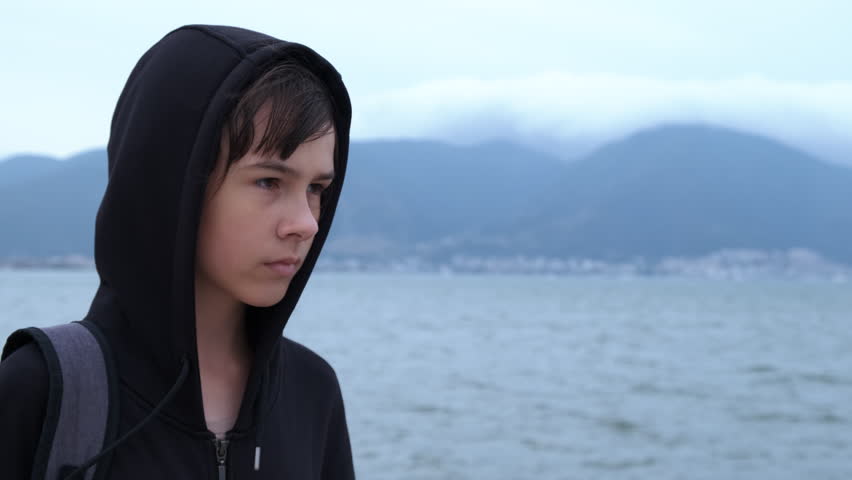 Teen depression. Depressed young schoolgirl with bad thoughts on the seashore.  | Shutterstock HD Video #1102782679