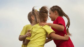 Happy kindergarten children hugging and jumping in nature. Friends in summer in park rejoice and play.Friendship of offspring outdoors.Children play together in park on green grass.Preschool education - Powered by Shutterstock - Get 15% off with code: PIKWIZARD15