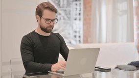Online Video Chat by Young Adult Man on Laptop