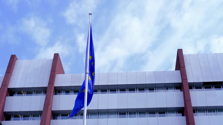 Strassbourg, France, August 2021: flag of European Union in front of building of international organization Council of Europe, concept of standards of law, human rights and cultural interaction
