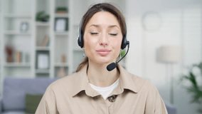 Young Caucasian woman working remotely sitting in home office. Business Female freelancer entrepreneur small business owner has video call meeting conference using laptop computer seller counseling