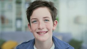 Portrait funny teenage schoolboy with freckles and braces with blue eyes smiling looking at camera at home or classroom indoors. Closeup Red-haired cheerful school boy, happy smiling Headshot Close up - Powered by Shutterstock - Get 15% off with code: PIKWIZARD15