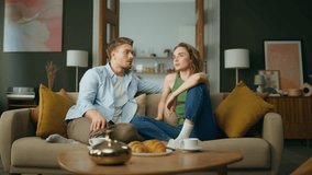 Calm family talking sofa at living room. Relaxed boyfriend girlfriend chilling couch discussing life routine together. Serious woman telling story handsome man at apartment interior. People lifestyle - Powered by Shutterstock - Get 15% off with code: PIKWIZARD15