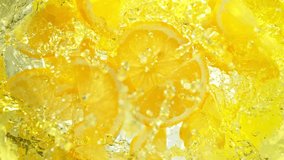 Super Slow Motion Shot of Fresh Lemon Slices Falling into Lemonade Whirl at 1000 fps. - Powered by Shutterstock - Get 15% off with code: PIKWIZARD15