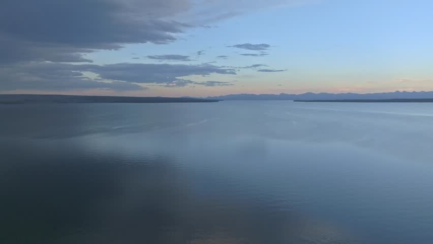 A panoramic aerial view of Yellowstone Lake at sunset. Huge lake the size of the sea.