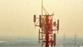 The antennas on a cell site tower transmit and receive data to and from mobile devices using various wireless communication protocols such as 4G LTE, 5G, or Wi-Fi. Technology and industry concept
