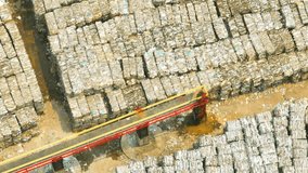 A kraft paper and corrugated paper factory, a type of paper made from wood pulp using the kraft process. The kraft process involves cooking wood chips with chemicals. Aerial view from drone. 4K
