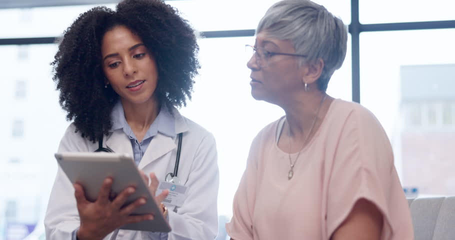 Healthcare, tablet and a woman talking to a patient during consulting with a doctor for insurance. Medical, trust and diagnosis with a female medicine professional explaining treatment to a senior Royalty-Free Stock Footage #1102823543
