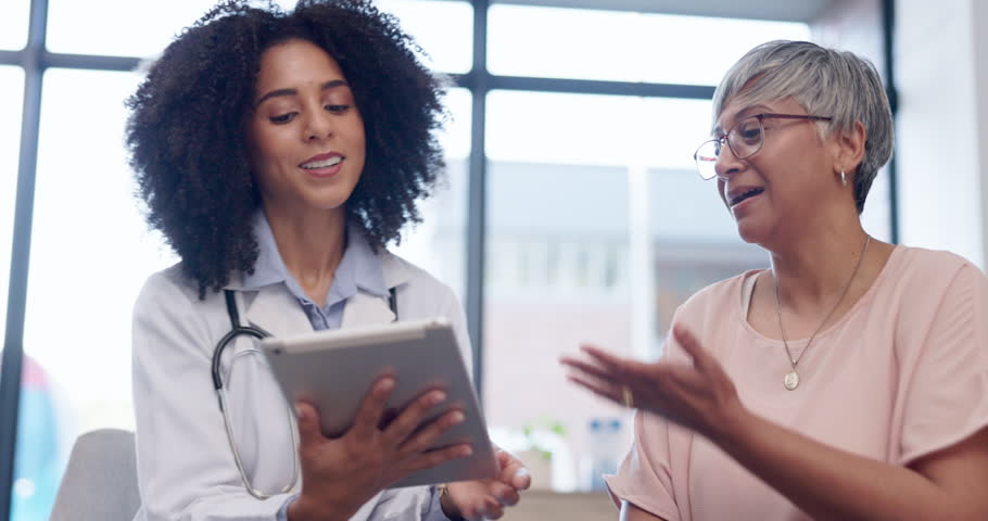 Healthcare, tablet and a woman talking to a patient during consulting with a doctor for insurance. Medical, trust and diagnosis with a female medicine professional explaining treatment to a senior