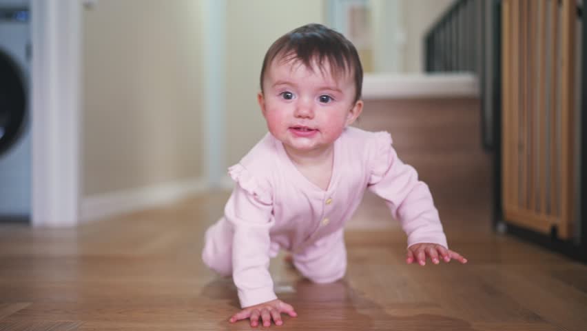 baby crawling. happy family first steps kid dream concept. baby newborn crawling down the hallway in the house. happy baby girl crawling on the floor takes her first steps lifestyle Royalty-Free Stock Footage #1102831719