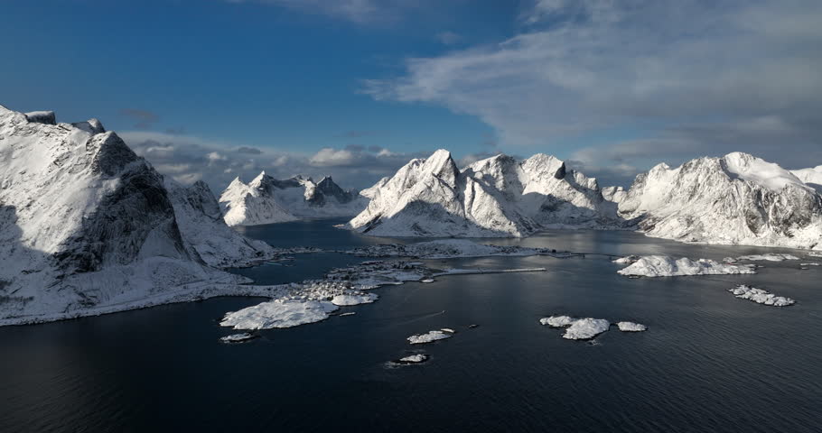 Aerial view of the Lofoten fiords, Norway, covered by snow in winter Royalty-Free Stock Footage #1102832315