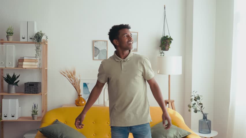 Cheerful black man enjoying his new house