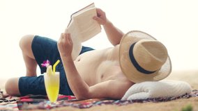 4K Asian senior man reading a book and sunbathing at tropical beach in sunny day. Retired elderly people relax and enjoy outdoor lifestyle travel nature ocean with family on summer holiday vacation. - Powered by Shutterstock - Get 15% off with code: PIKWIZARD15