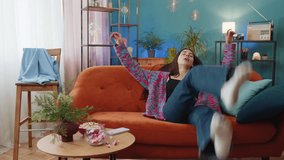 Tired woman lying down on comfortable couch, taking a rest, daytime nap. Portrait of carefree Caucasian girl holding hands behind head relaxing, falling asleep at home apartment living room on sofa - Powered by Shutterstock - Get 15% off with code: PIKWIZARD15