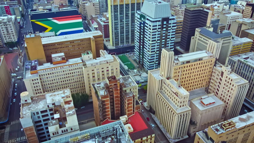 Tilt up revealing the Johannesburg skyline Royalty-Free Stock Footage #1102841937