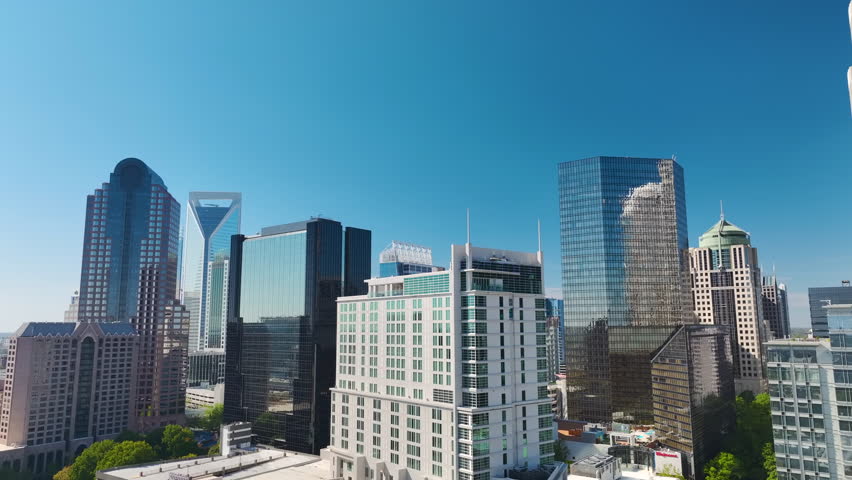 Aerial view of downtown district of Charlotte city in North Carolina, USA. Glass and steel high skyscraper buildings in modern american midtown